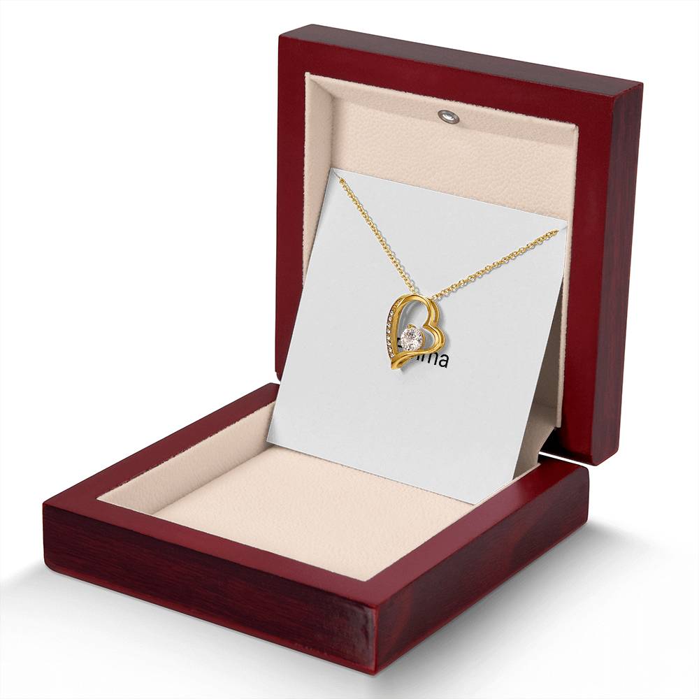Gold Forever Love necklace in a wooden gift box