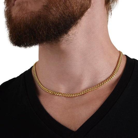Gold Cuban link chain worn, close up