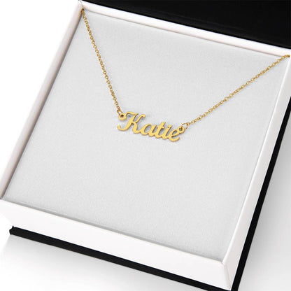 Dainty 18k gold name necklace worn close to the collarbone